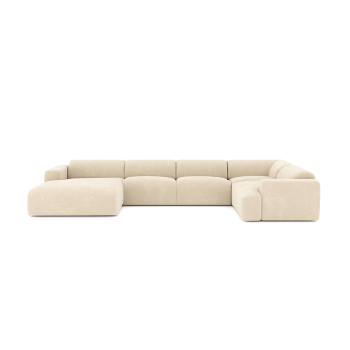 Panoramische sofa links, bekleed met crèmekleurig fluweel met patroon.