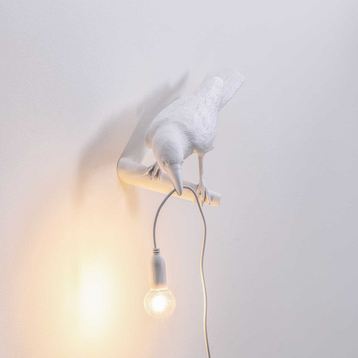Bird Looking wandlamp links buiten wit