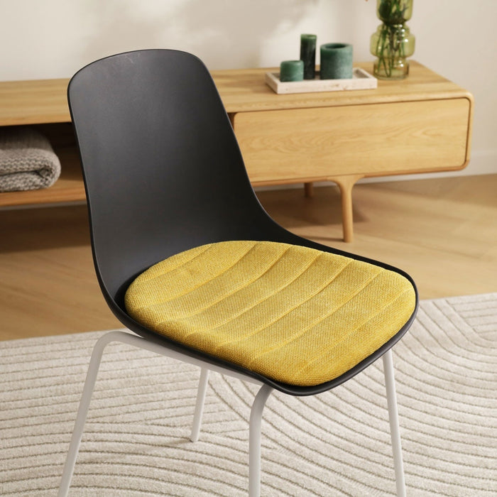 Nolon Nora-Liv Eetkamerstoel Zwart - Okergeel Kussen - Witte Poten