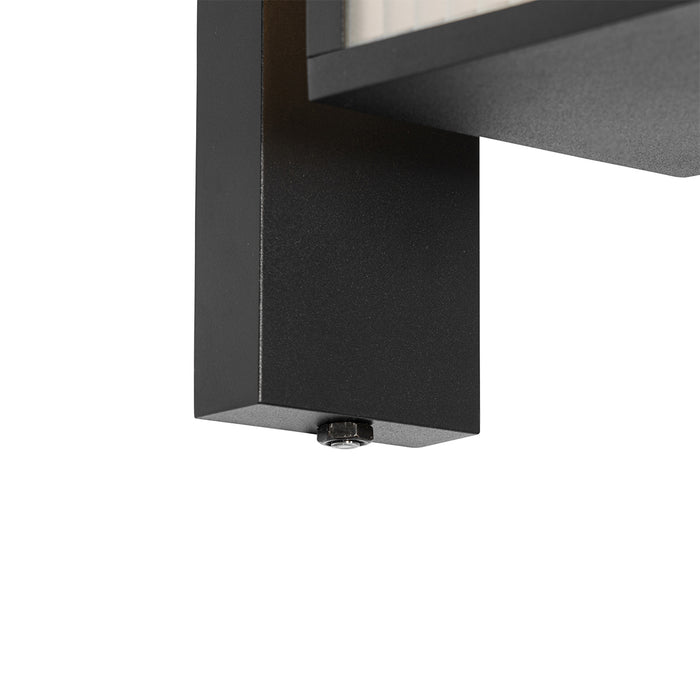 QAZQA Buiten wandlantaarn zwart met ribbel glas en schemersensor -